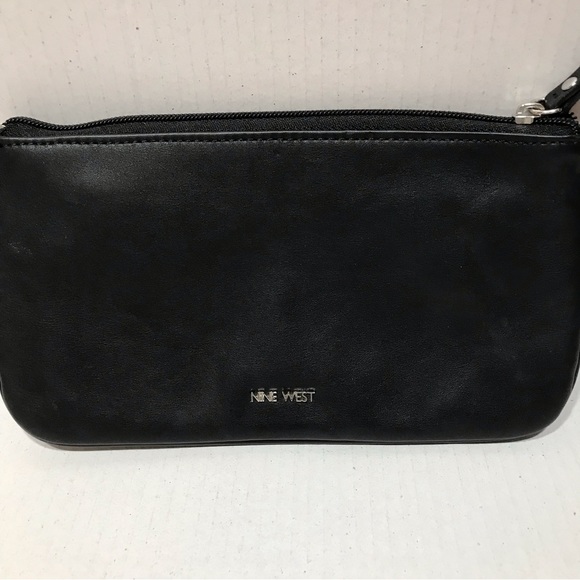 Nine West Black and White Cutout Flower Wristlet. - Picture 2 of 4